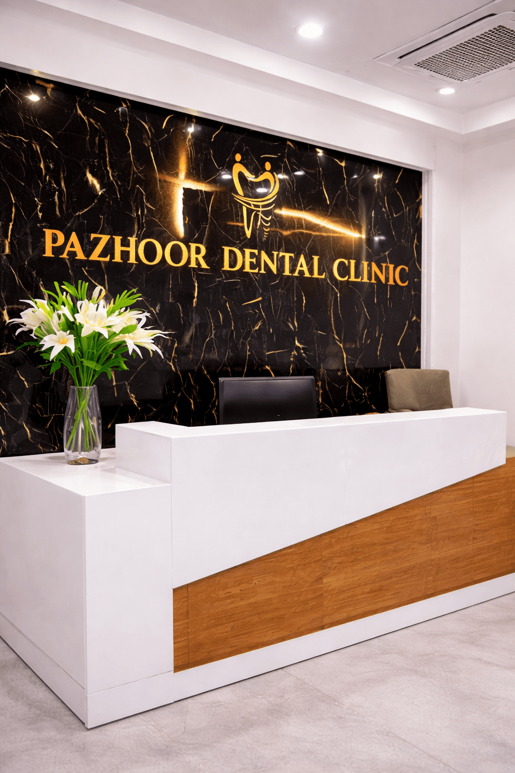 Interior of Pazhoor Dental Clinic with warm wood tones and a calm treatment room